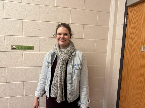 French teacher Anne Holzhausen wears scarf she knitted.