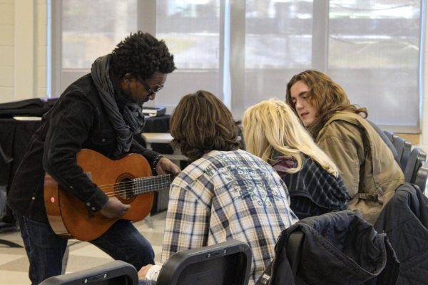 STUDENT SONGS: Midtown students participate in the Jan. 9 workshop with professional recording artist David Ryan Harris. These workshops offer feedback for students to help them build skills.