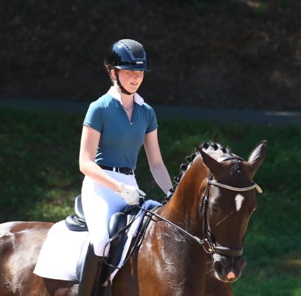 Sophomore Lauren Polk spends most of her free time in the barn, training and taking care of her horse. As she progresses, Polk hopes to train others and compete at the Olympics. (Courtesy of Lauren Polk)