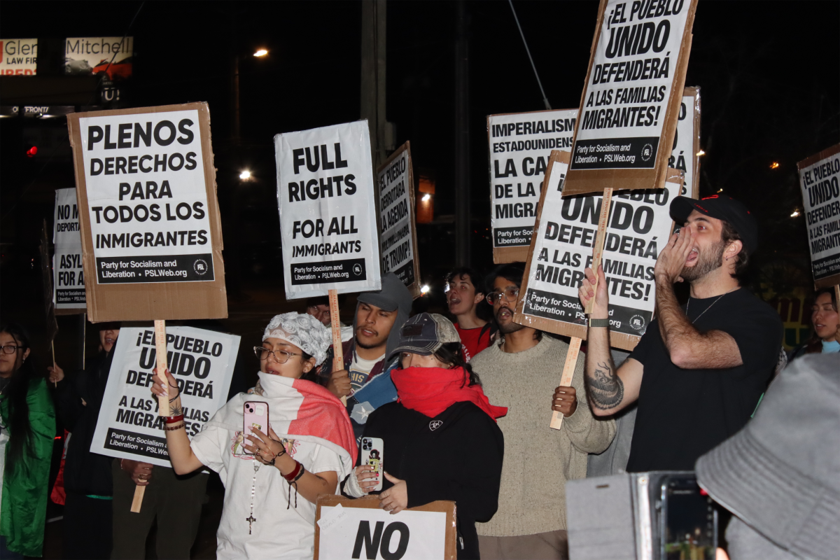 FULL RIGHTS: A crowd gathered outside Plaza Fiesta to protest President Trump's immigration policy and demand "full rights for all immigrants."