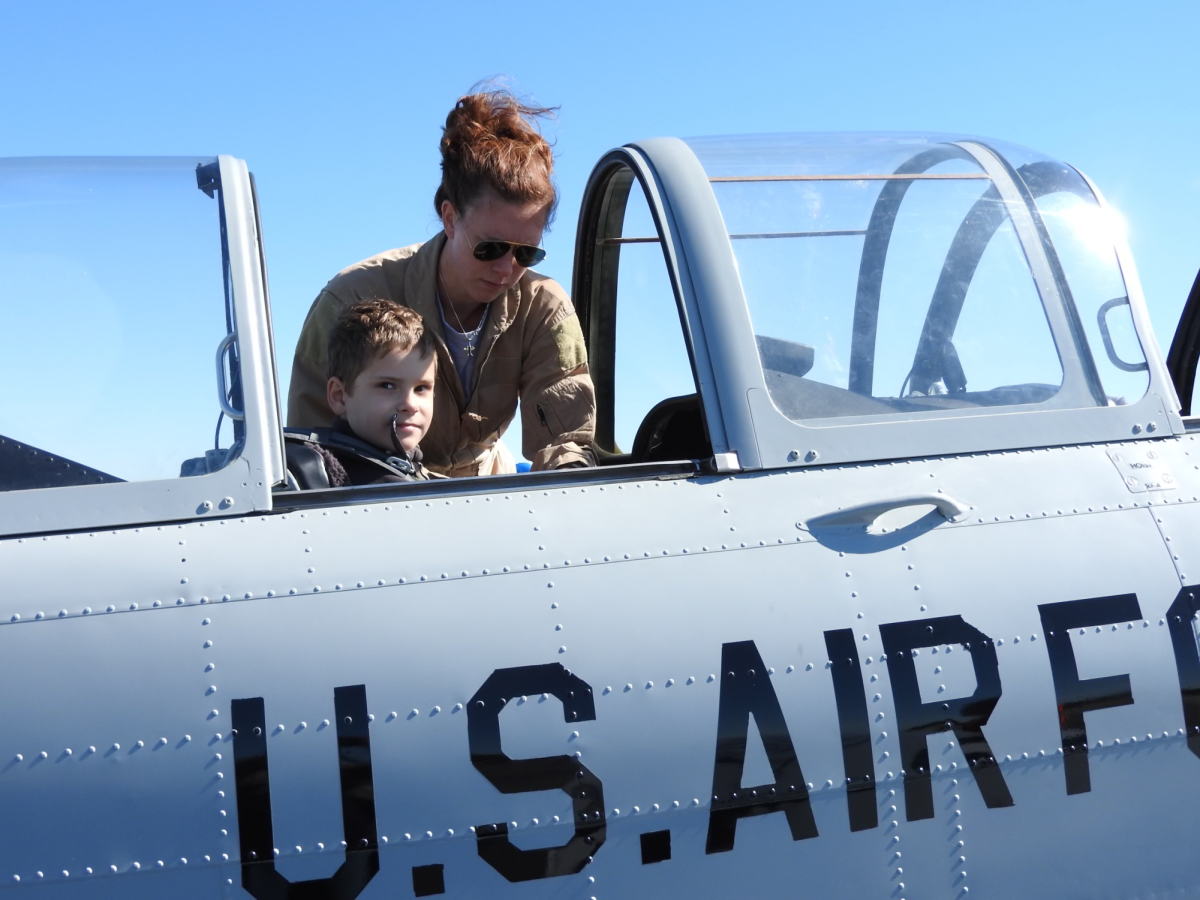 PASSIONATE PILOT: Senior Nate Kirkland (left) has been passionate about flying planes ever since he first watched an airshow at age 9.
A flight instructor (right) at the Peachtree-Dekalb Good Neighbor Day Air show accompanies him on his first time in the cockpit, sparking his passion. (Courtesy of Nate Kirkland) 