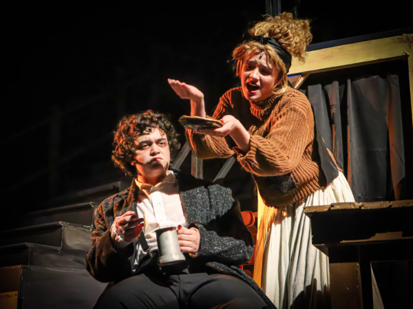 Playing Mrs. Lovett, senior Caroline Conners cries in despair over her unappealing pies that she bakes to Jack Morris, who played Mr. Sweeney Todd.