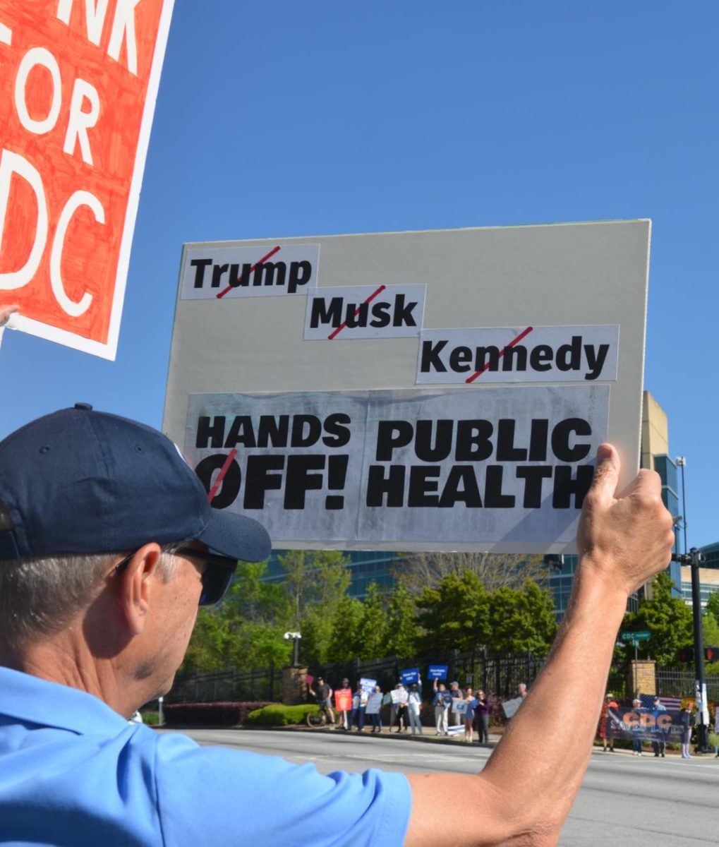 COMMUNITY RESISTANCE: Every Tuesday evening, protesters gather outside the CDC to cheer on workers as they leave and speak up against the firings and budget cuts. 
