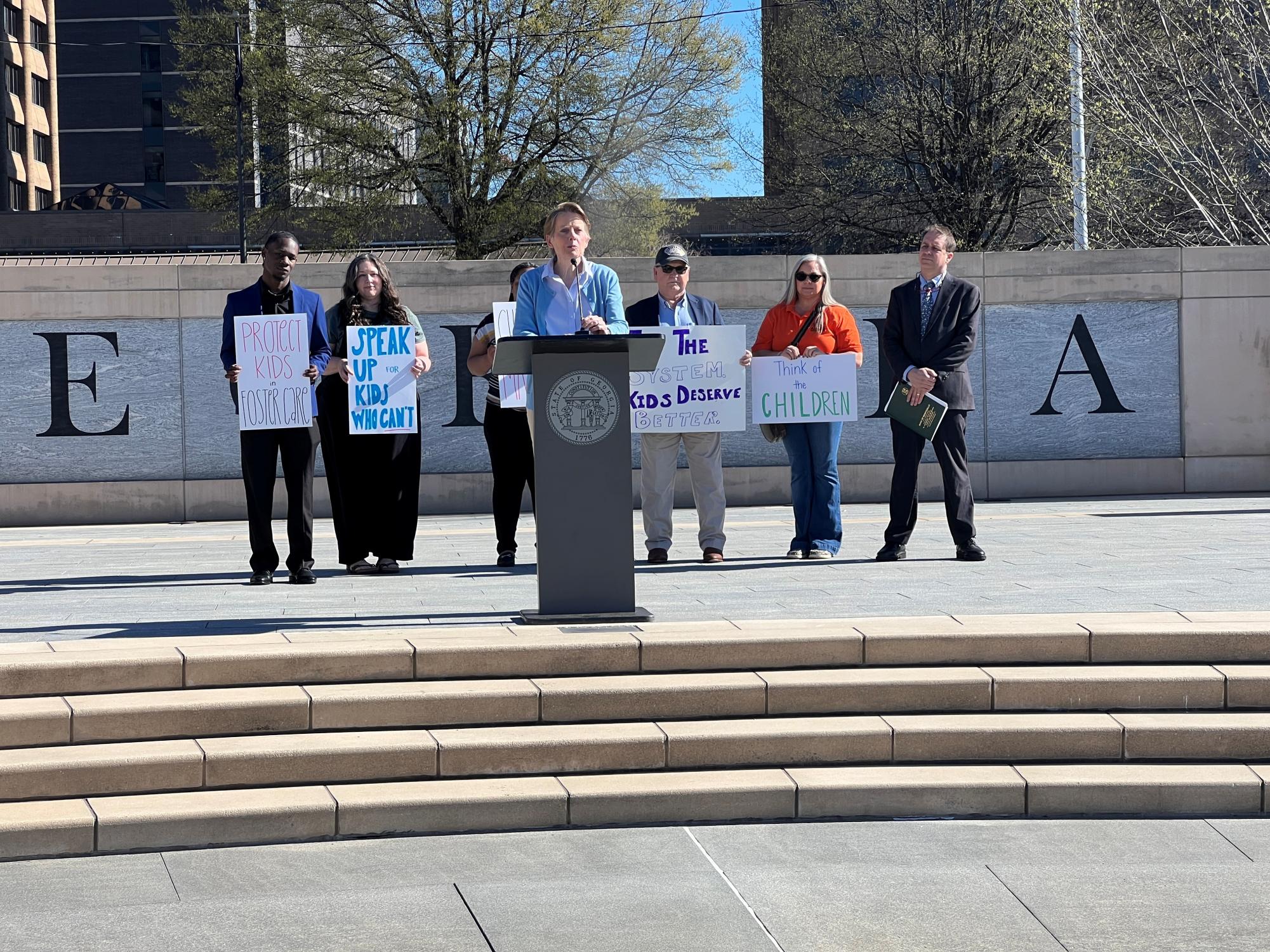 CAPITOL STEPS: Midtown principal Dr. Betsy Bockman, gives a speech on the steps outside of the Georgia State Capital to advocate for foster care rights. CREDIT: Dr. Betsy Bockman