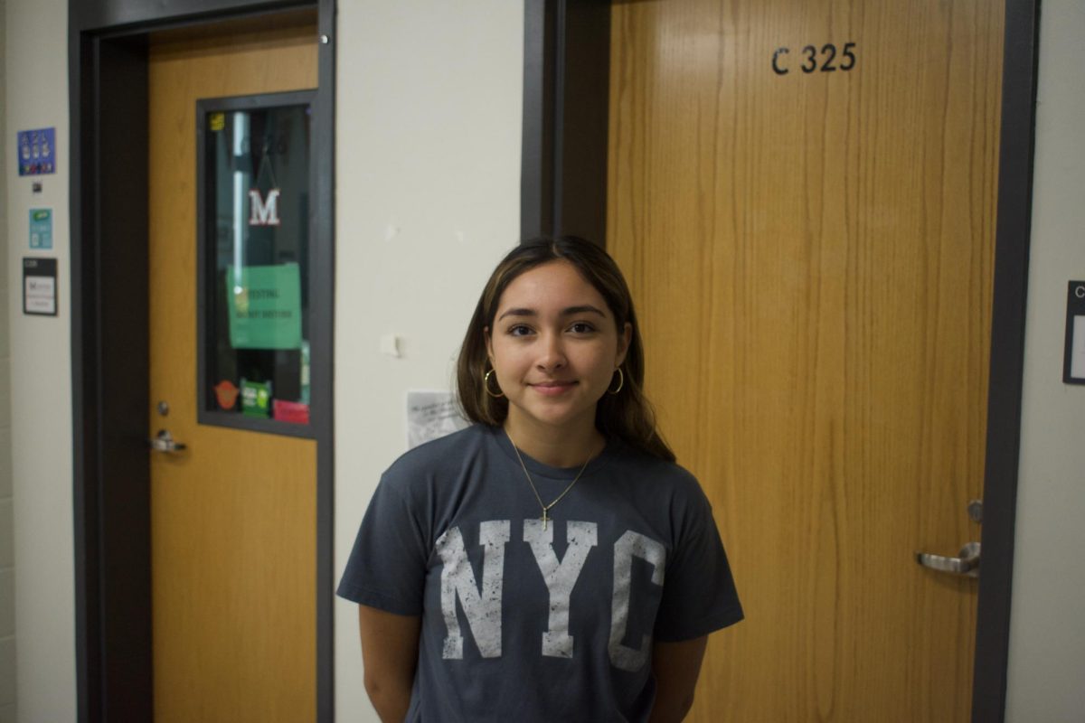 Sophia Walker poses outside of her speech forensics class.