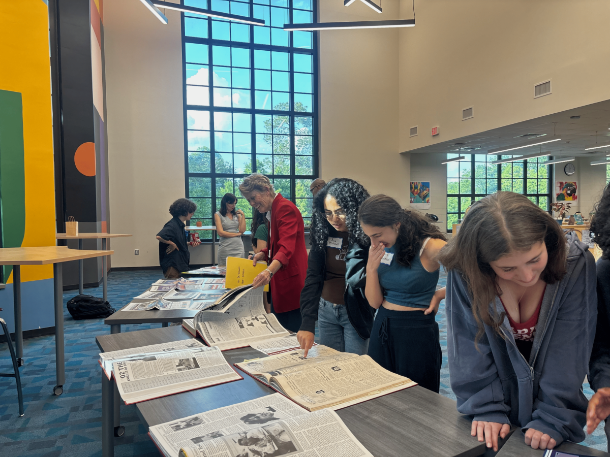 APRIL EVENT: At the launch of the booster club, event attendees browsed old Orator yearbooks and Southerner newspapers before the start of the event. 
