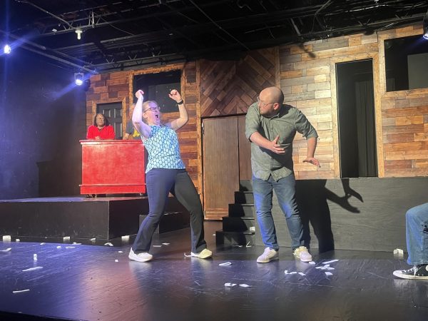 SCIENCE SCENE: Amanda Rountree [left] and Bret Bramkins [right] enact a slow-motion comedic act, using spontaneous vocabulary throughout the act. Rountree said she enjoys doing science improv because of the diverse audience.