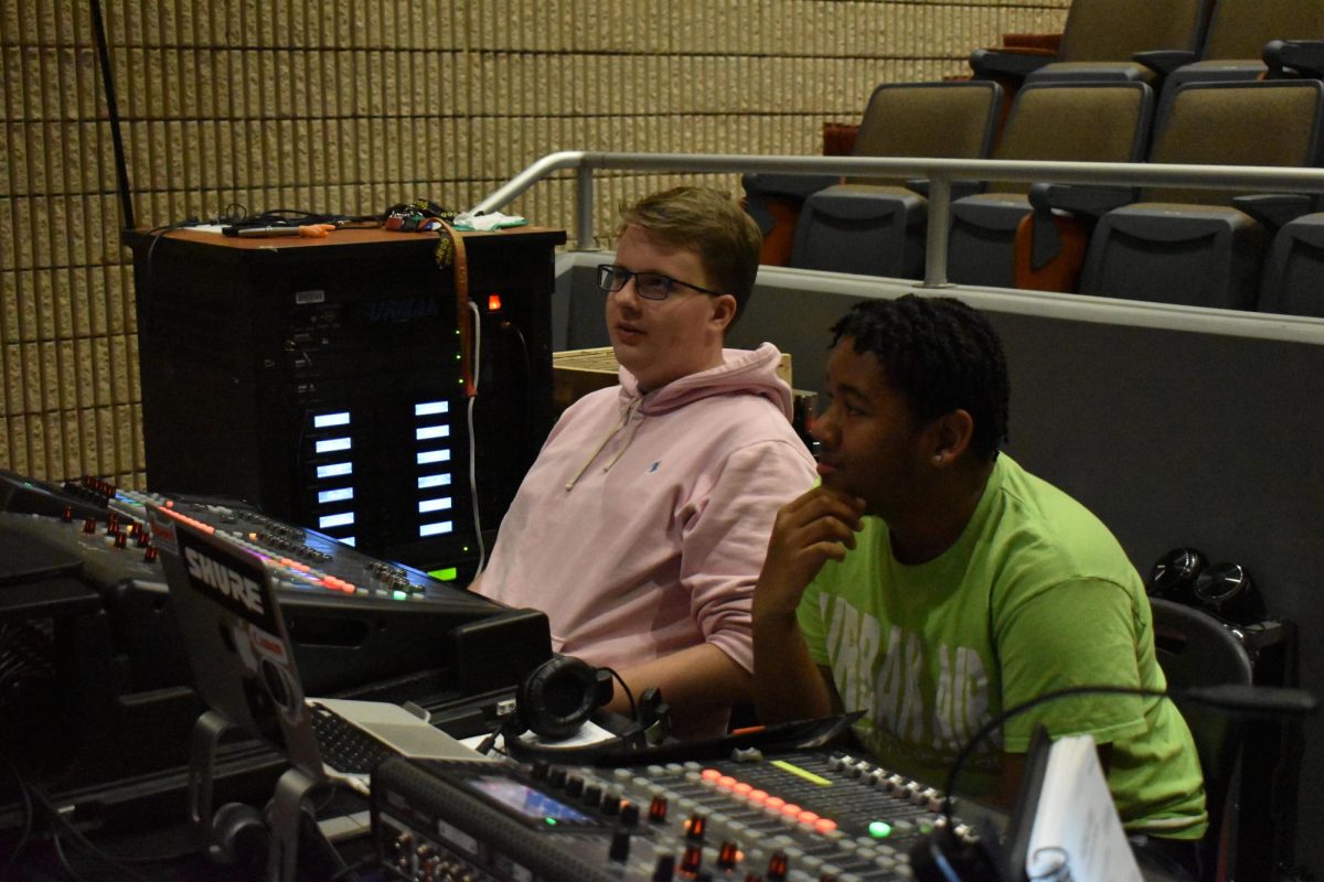 MICROPHONE MANAGERS: Senior Wyatt Cocroft (left) and junior JordanDavis (right) work on sound for "Sweeney Todd," the spring musical (Courtesy of Ivy May).