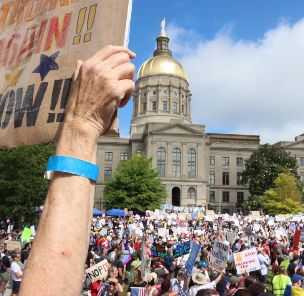 CROWD MANAGEMENT: Organizers gave out limited wristbands to make sure Liberty Plaza didn't exceed its capacity of 5,000. Thousands of other protesters filled the Capitol steps and street.
