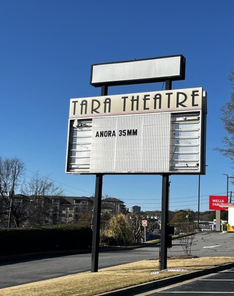 The Tara Theater's marquee advertises The Oscar Best Picture winner 'Anora' being played on the movie's shot format of 35mm film.
