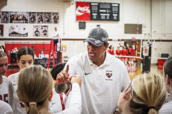New volleyball head coach Rafael Silva gives encouragement to the team during the Knight's game against Druid Hills on Aug. 21. Silva started a youth volleyball club in Atlanta called Rio and has played professional volleyball himself.