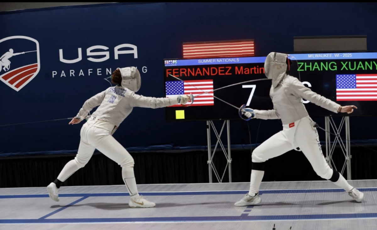 Fernandez (left) scores a point against her opponent during the U.S Summer Nationals, where she placed first out of 300 competitors. 