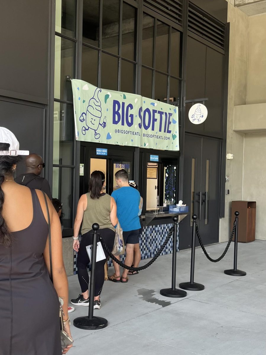 Customers wait and consider menu options outside of Big Softie’s window.