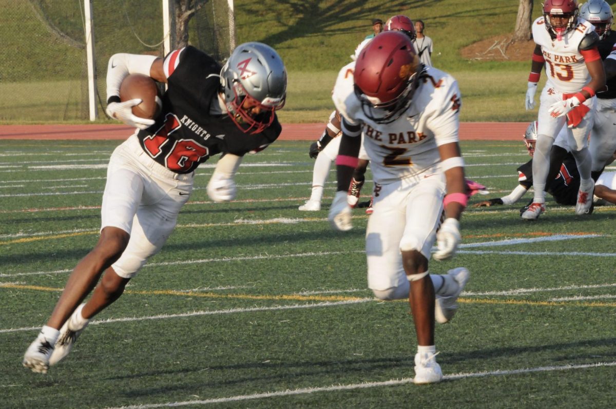 Senior wide receiver Kyrie Blackman receives a pass against Forest Park. The Knights won 18-7. Blackman also returned a punt for 65 yards to set up a touchdown.