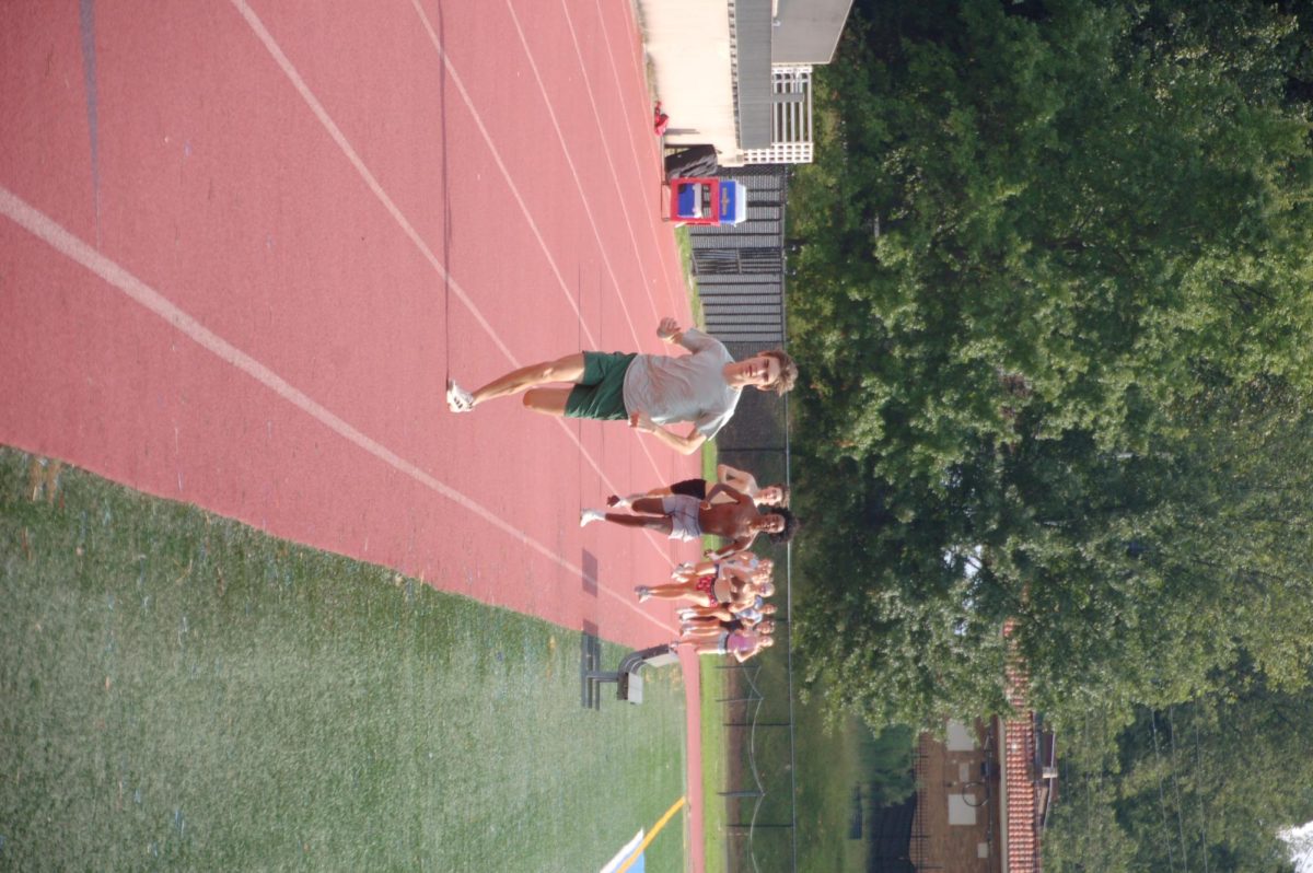 Senior Captain Dries Williams leads warm up lap around track at afternoon practice