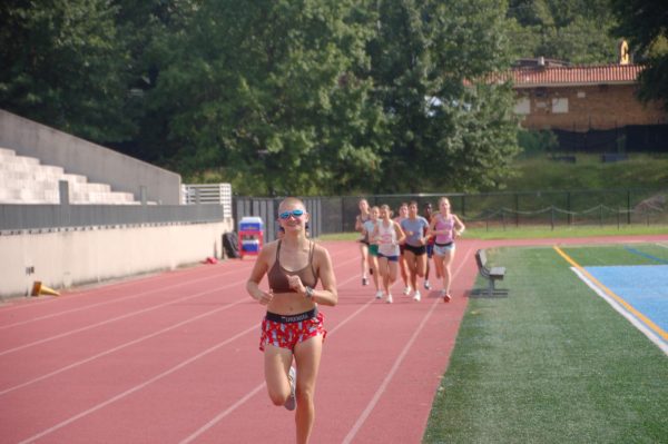 Junior James Roberts begins practice with a warm up lap around the track on Aug. 29, 2025.