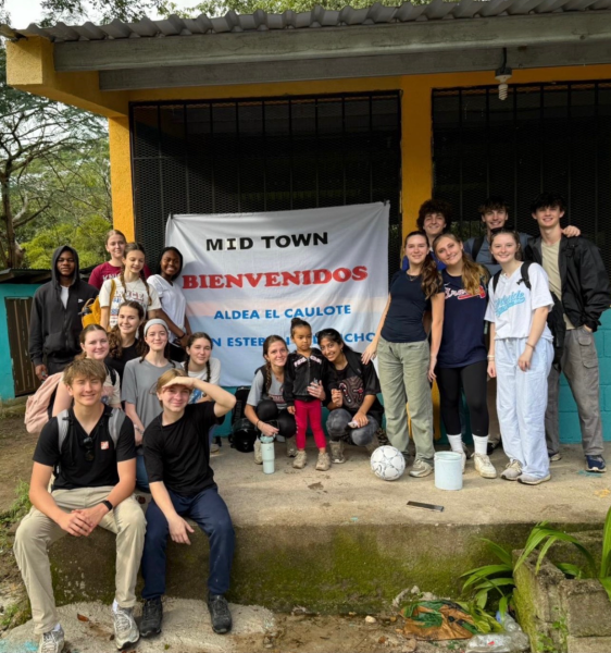 The local children of San Esteban, Honduras welcome Midtown students in preparation for their service work. 