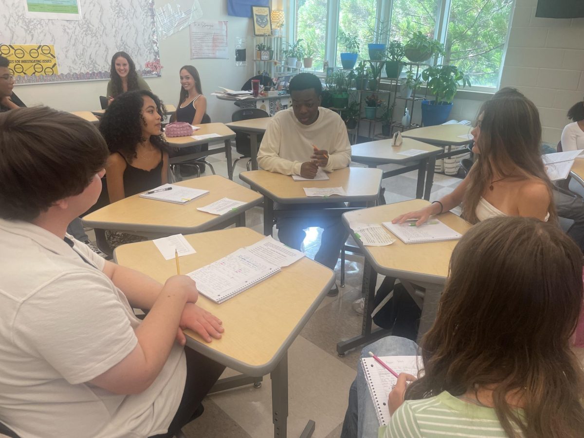 Students in Midtown's Literary Magazine class write samples of their handwriting in an assignment to help flag artificial intelligence. 
