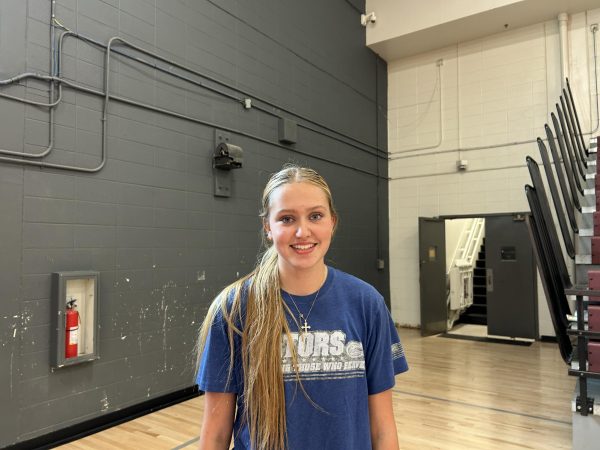 Sophmore Roberts smiles before volleyball practice.