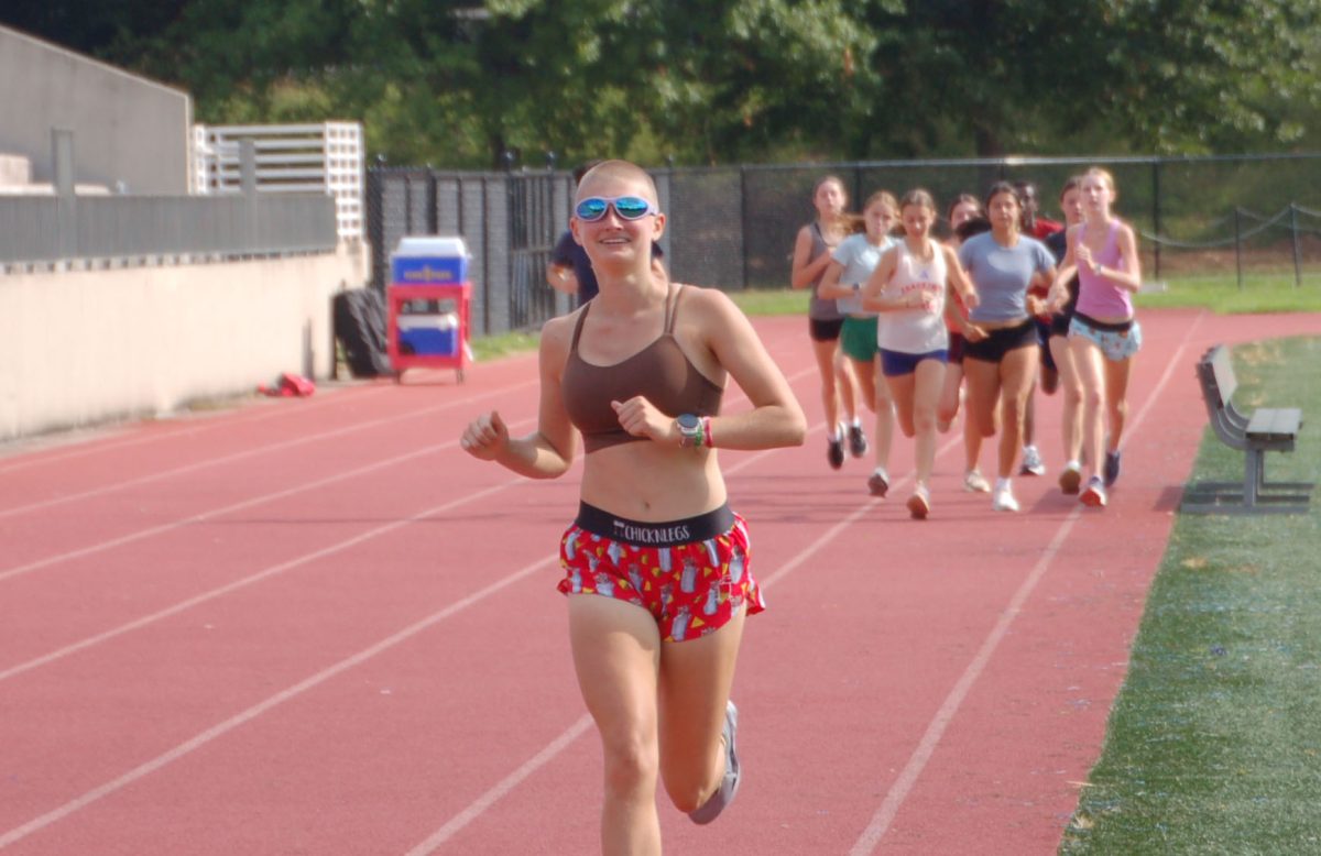 Junior captain James Roberts begins practice with a warm up lap around the track on Aug. 29.
