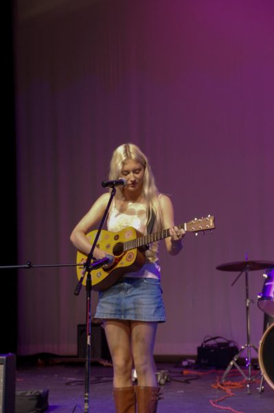 Junior Reagan Vale plays an original song, beautifully harmonizing with her guitar.
