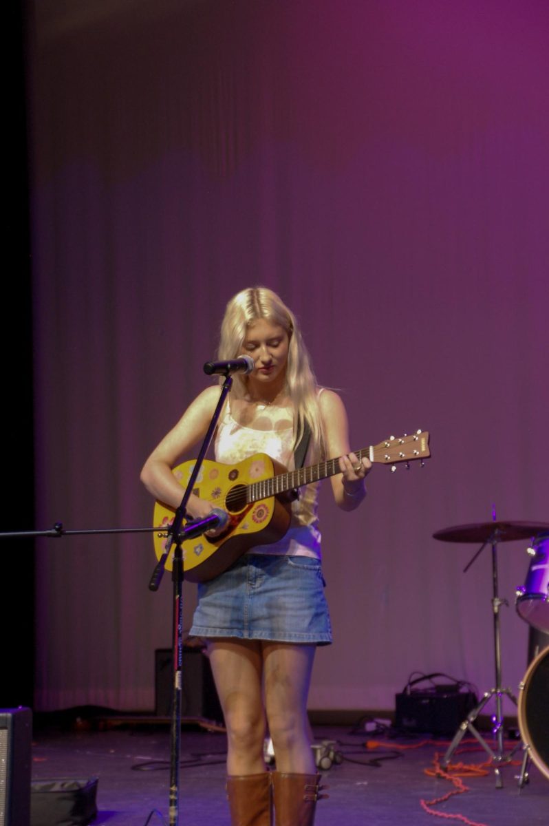 Junior Reagan Vale plays an original song, beautifully harmonizing with her guitar.