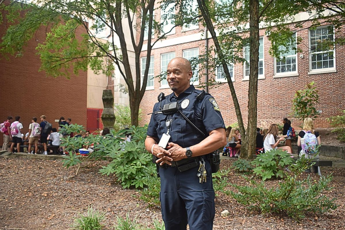 BEYOND THE BADGE: Officer Derek Hammond patrols courtyard as students eat during their lunch break.