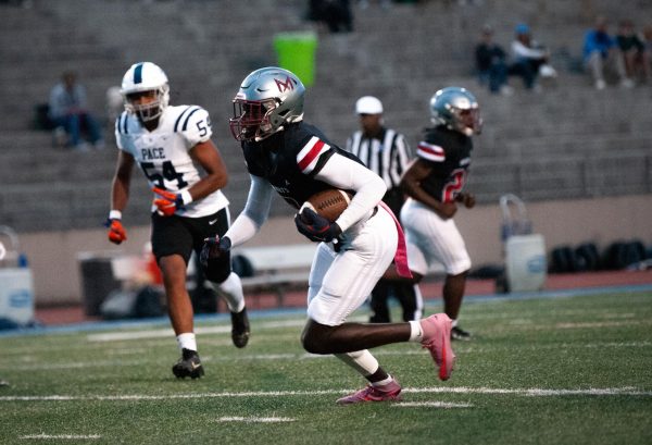Senior wide receiver Kentrell White rushes the ball during the Oct. 2 game against Pace, resulting in a 95 yard touchdown. White got two touchdowns for the Knights and the game resulted in a 27-12 win. 