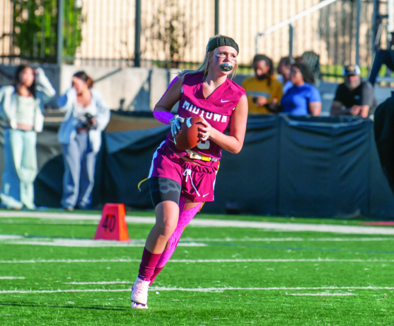 Sophomore Emma Companiotte rushes down the field in the Knights inaugural against Alcovy, on Oct. 2,  which ended in a 20-0 loss. This was their first game ever, as the program was introduced in Fall 2025.