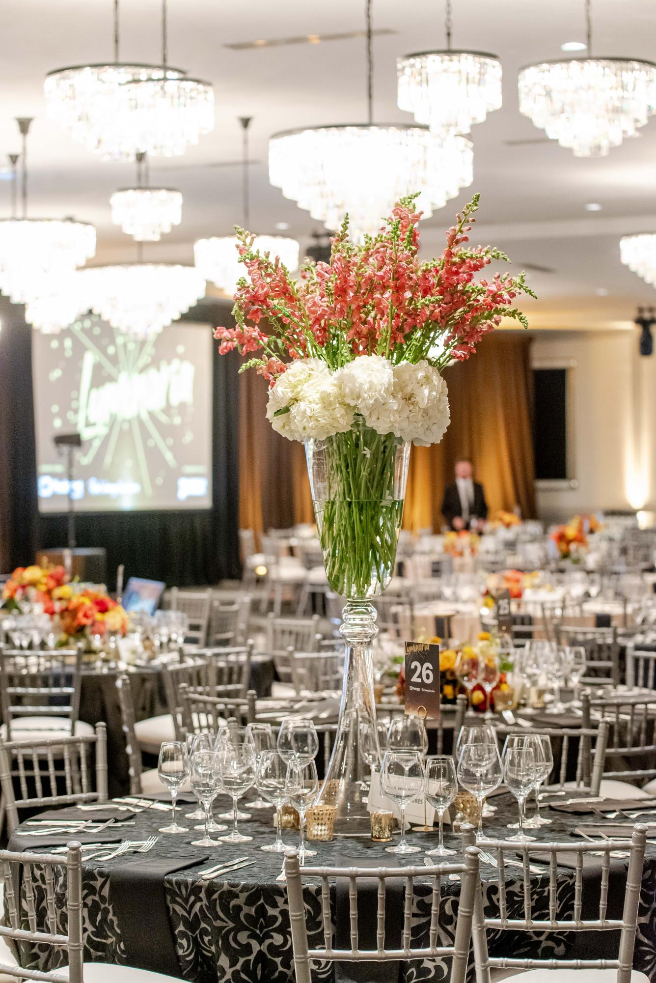TABLETOP TOUCHES: The Piedmont Healthcare Foundation team spent months planning every aspect of the gala, including the setup pictured with beautiful linens and tall floral arrangements.
