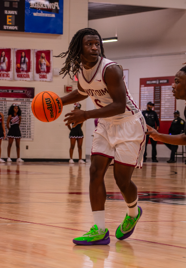 Senior Cam Austin dribbles toward the basket. The Knights beat M.L. King 68-45 on Dec. 2.