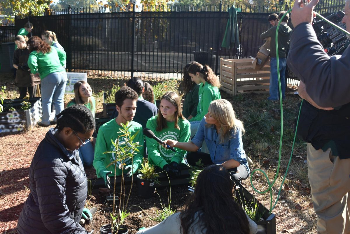 TV TIME: CNN anchor Lynda Kinkade interviews senior AP Environmental Science students, Orlando Brown (left) and Giulia Ret (right) about the new plants in Midtown's garden.
