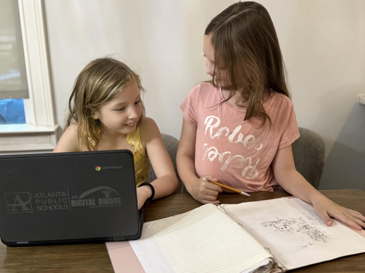 BUDDING WRITERS: Virginia-Highland Elementary students who participate in the Writing Club collaborate on their creative works, which include both visual and literary assignments. The students cover many different kinds of writing like fiction, non-fiction and journalism.