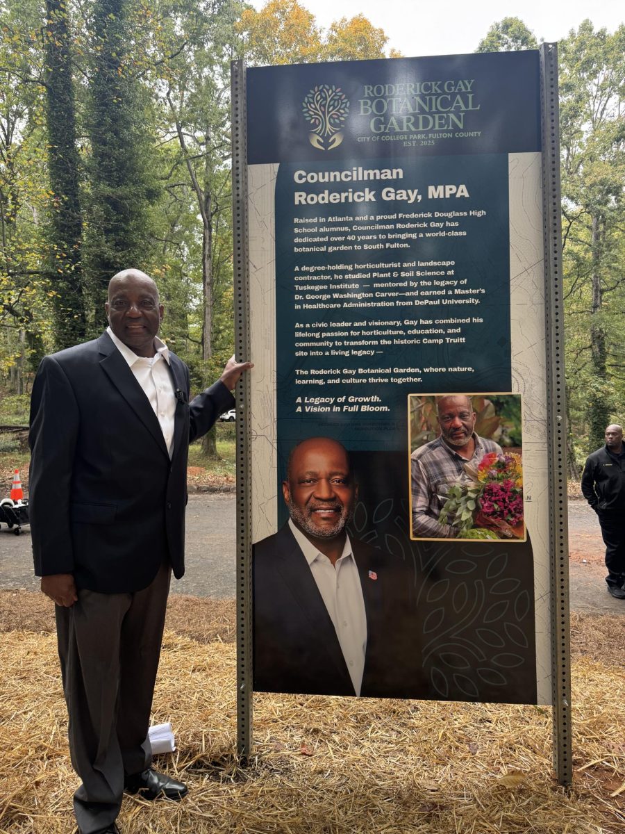 IN BLOOM: College Park City Council Member Roderick Gay stands in front of the dedication marker for the park named after him before construction of the new Botanical Garden. 