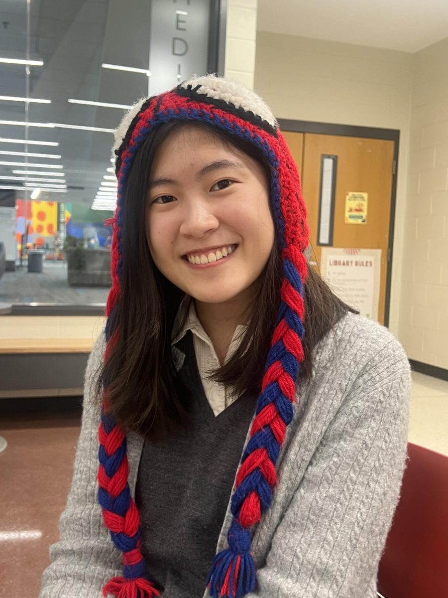 Freshman Ellie Nguyen smiles while waiting for G3 Robotics to begin.