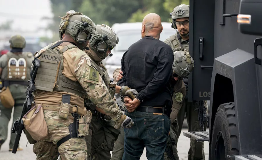 UNREGULATED DETAININGS: Immigration and Customs Enforcement (ICE) Enforcement and Removal Operations detain a man in
the streets of Los Angeles, California during increased spikes of detainment nationwide under the Trump administration’s efforts.
