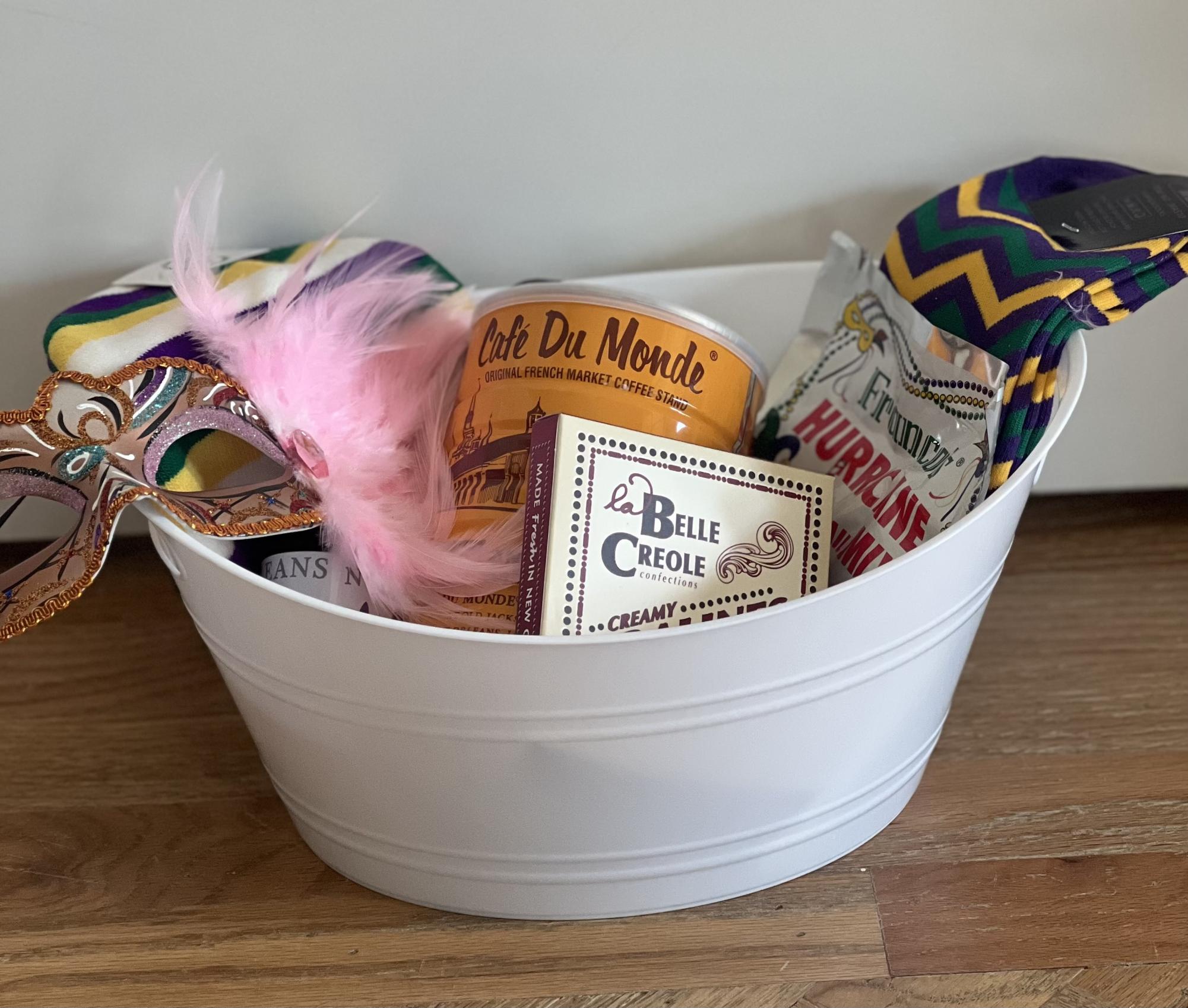A Mardi Gras themed gift basket put up for auction, consisting of many different prizes.