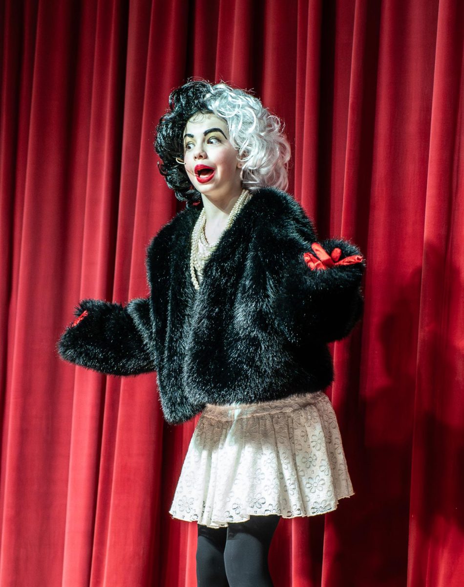 SPOTS AND STAGE LIGHTS: Fifth-grader Clara Wells played the role of Cruella De Vil in “101 Dalmations.” Well said playing the villain was especially fun.
