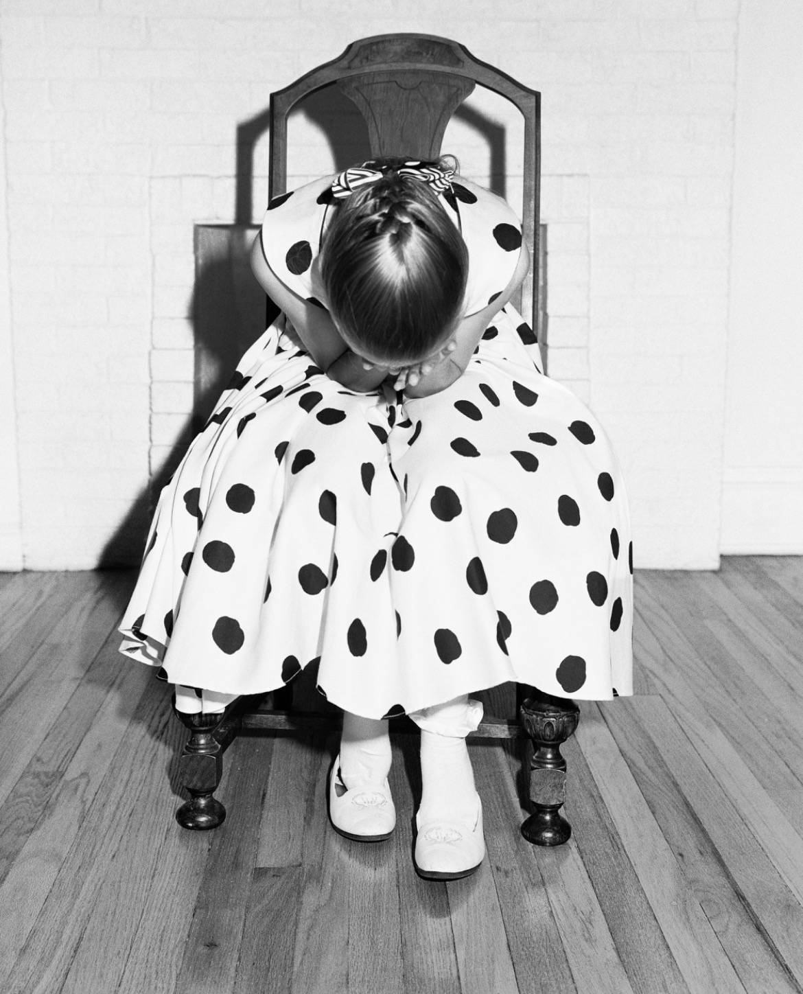 EXPLORING FEAR: Plumb’s work touches on themes of political and social
instability over multiple decades. (CREDIT: Mimi Plumb (American, born 1953), Girl in the Polka Dot Dress, 1990, gelatin
silver print, High Museum of Art, Atlanta, gift of the artist, 2025.106. © Mimi Plumb.)