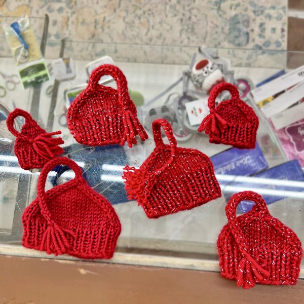 KNITTING CHANGE: Mini 'Melt the ICE' hats are being sold at the Needle Nook in Atlanta for non-knitters to participate in silent protests against U.S Immigration and Customs Enforcement (ICE). 