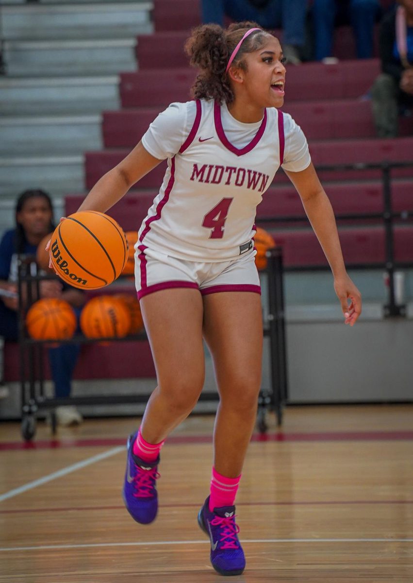 Junior Journey Bryant dribbles against Pace Academy on Jan. 30. The Knights won the game 56-45.