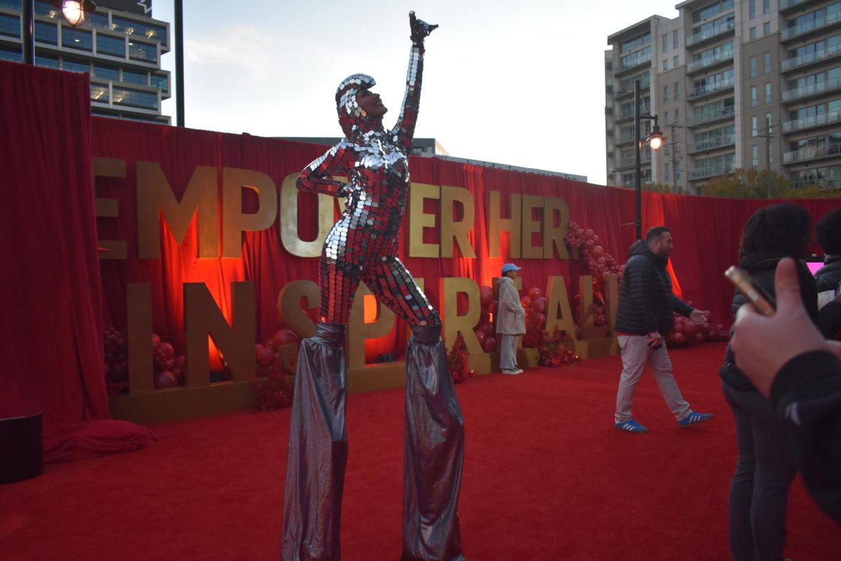 Entertainer at the "Empower Her. Inspire All." event on Nov. 11, 2025 dances on stilts to symbolize women empowerment.