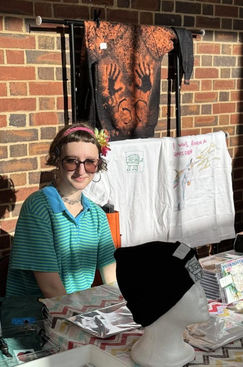 MAKING SALES: Junior Violet Verdi makes and sells shirts, pieces of jewelry, hair clips and other products through her small business.