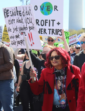SIGN HOLDING: Protest attendee Linda Smith attended the downtown Atlanta leg of the "No Kings" protest holding a sign about Trump voters.