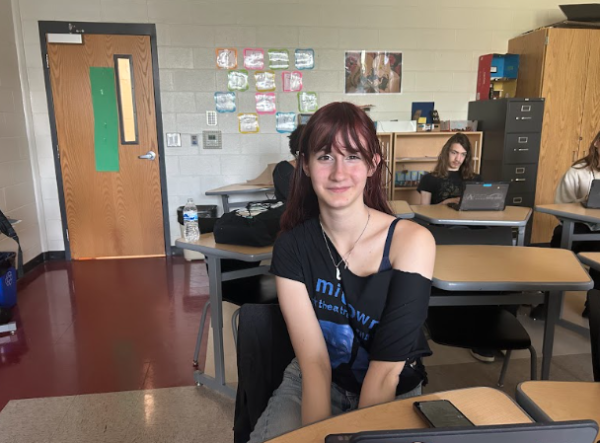 Eris smiles in American Sign Language 3 class.