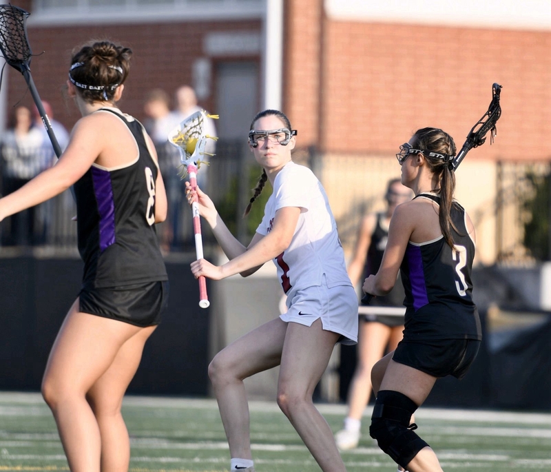 Midtown sophomore Julianna Richman looks for an opening against East Coweta defense during the Knights’ late-season matchup.