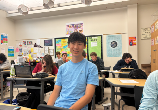 Sophomore Patrick Kearns smiles in AP Computer Science Principles after working on his Create Performance Task on Apr. 27.