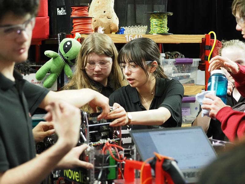 CREDIT: Trenee Uzoka
GLOBAL COMPETITION: The Robotics team has continued it’s two-year streak by qualifying for Worlds again. Freshman Molly Thurmond (left) and sophomore Amelia De Sutter (right) work on fixing the turret together.