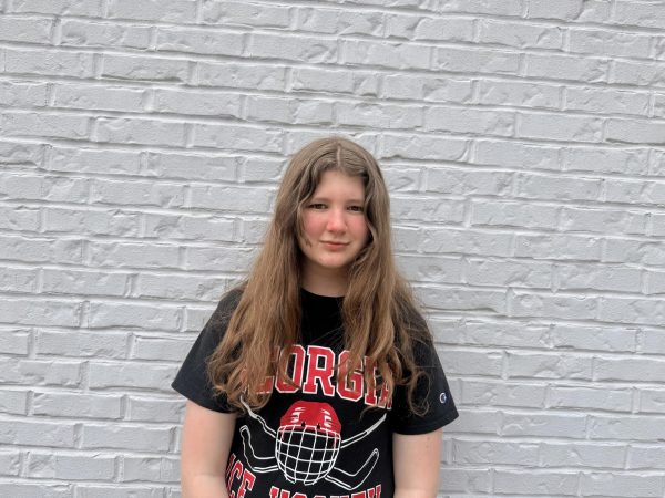 Freshman Molly Thurmond stands outside of Umma Kitchen wearing a University of Georgia Ice Dawgs hockey T-shirt.